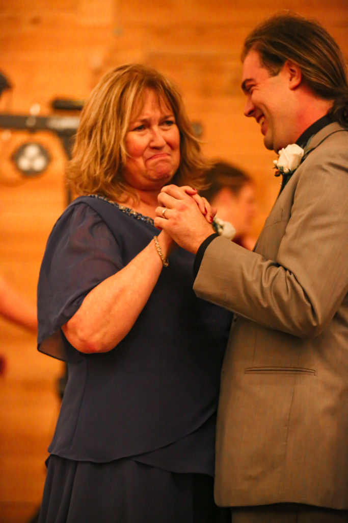 Mom and son dance at a NC beach Wedding 
