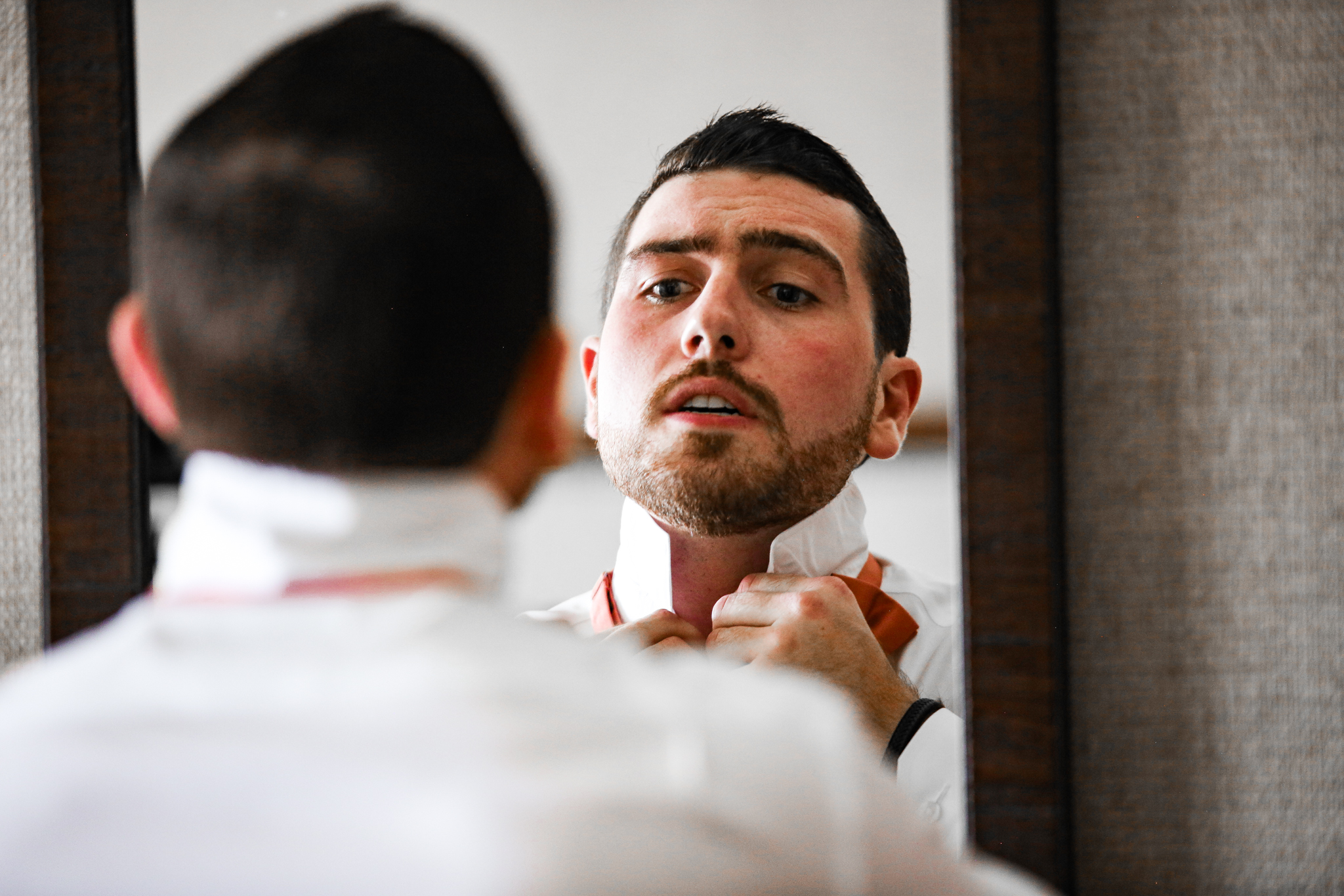 Light Shifter studios captures a groom getting ready at the Grove Park Inn in Asheville North Carolina. 