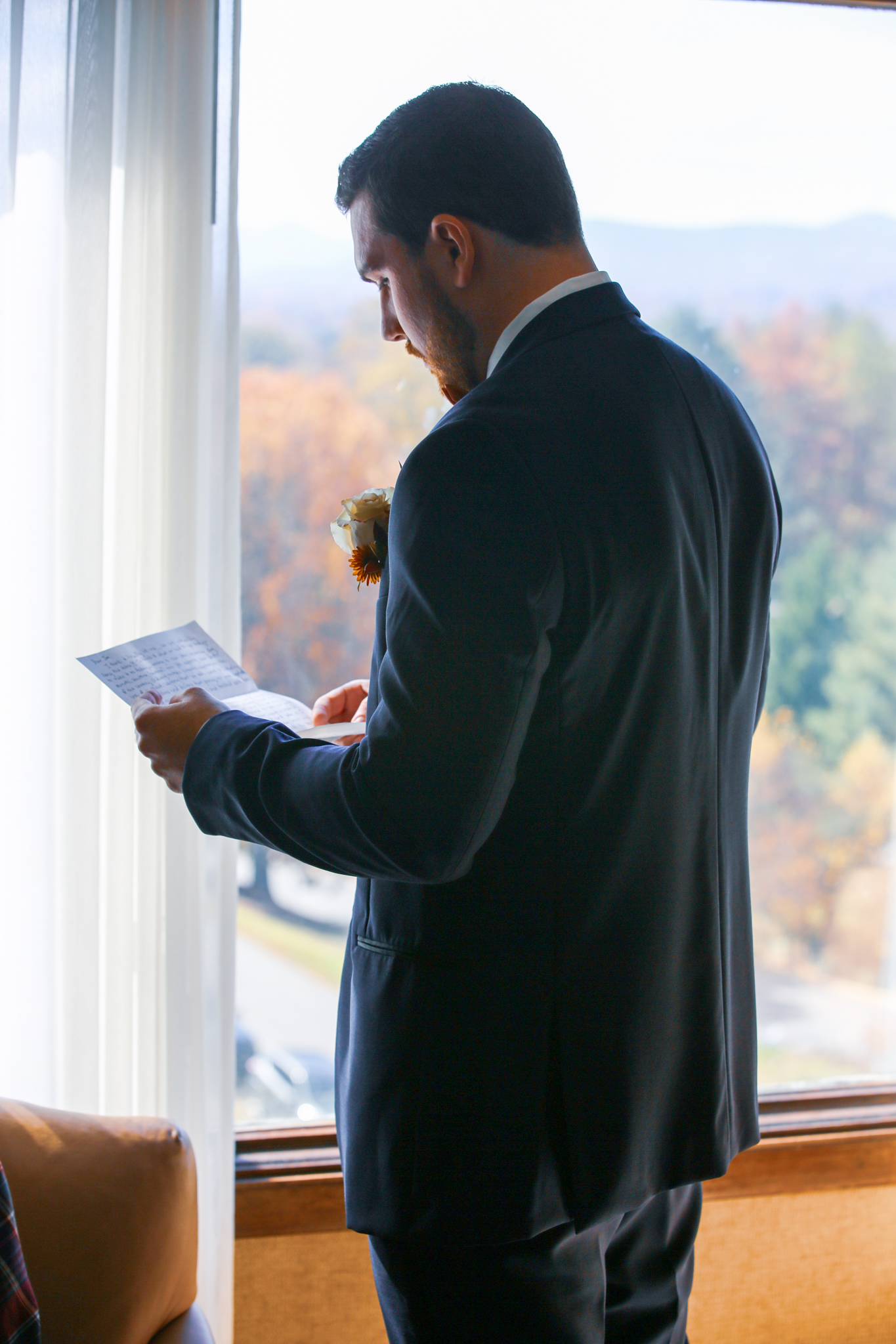 A groom reads his soon to be brides letter at his wedding in Asheville Nc. 