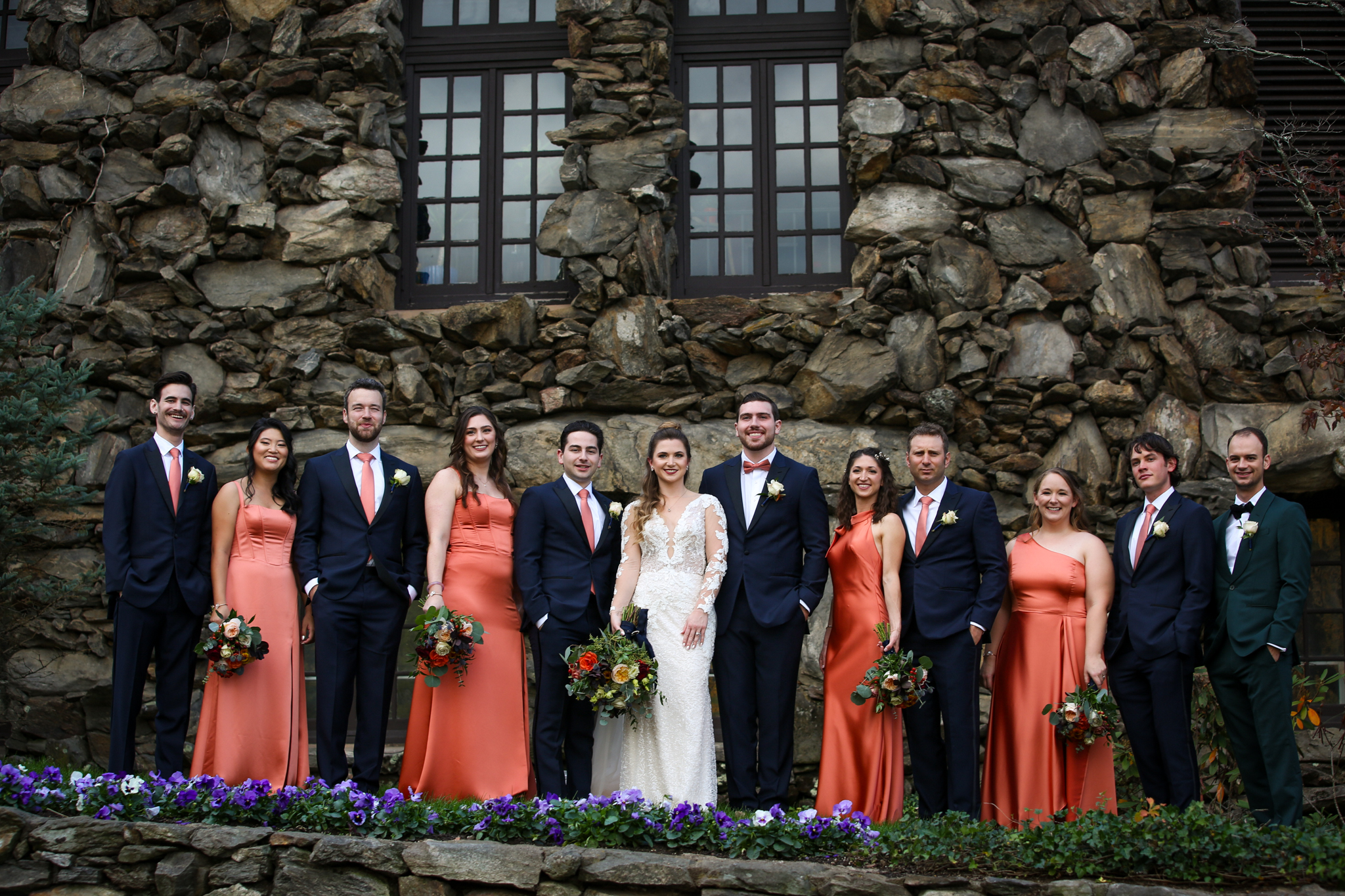 A wedding party takes portraits at the Grove Park Inn with Bryce Lafoon. 
