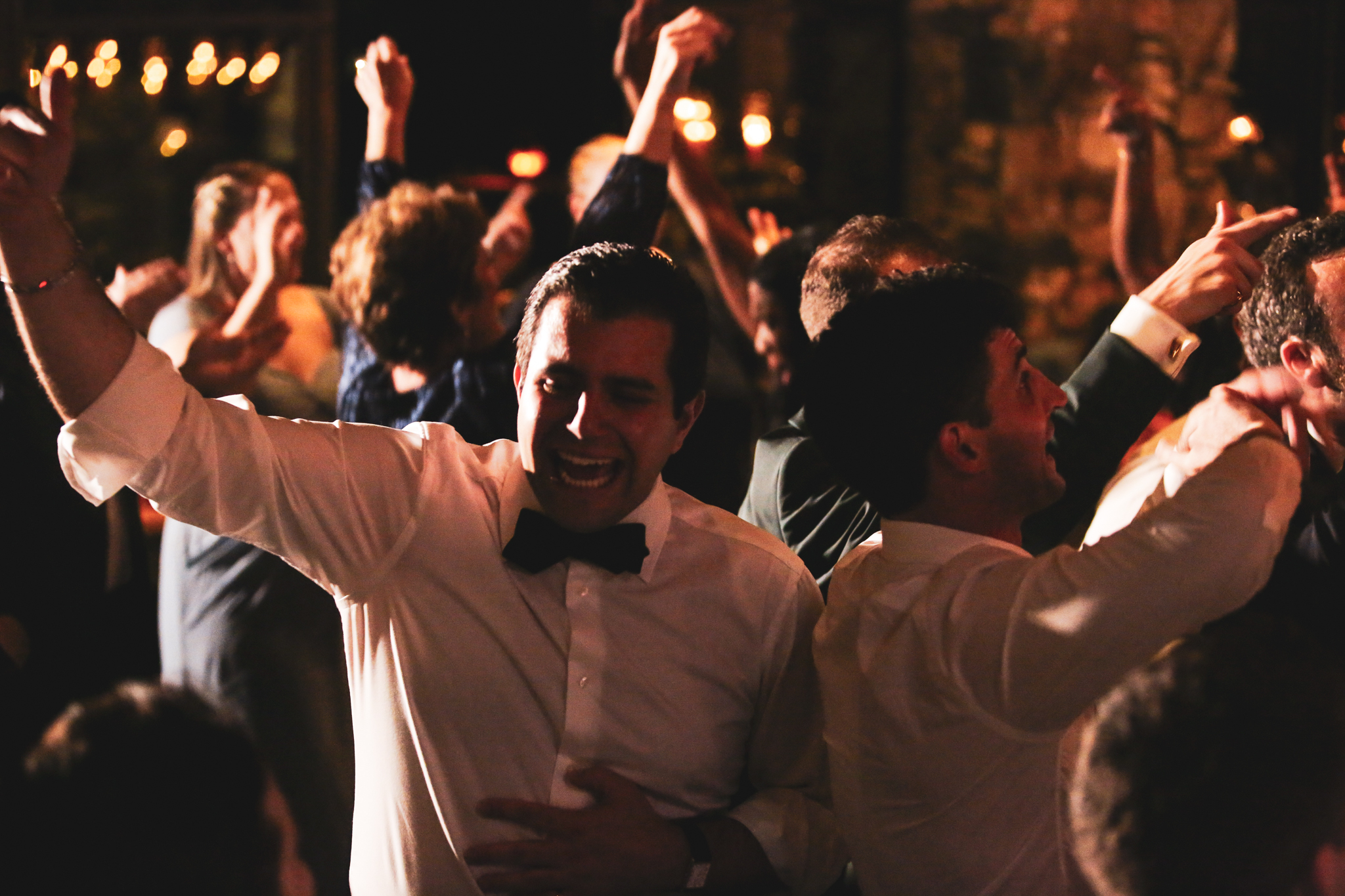 Men dance on the dance floor at the Grove Park Inn Wedding. 